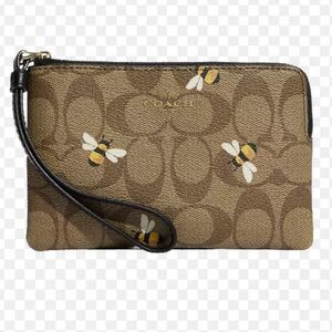 COACH Brown Khaki Corner Zip Wristlet in Signature Logo Bee Print